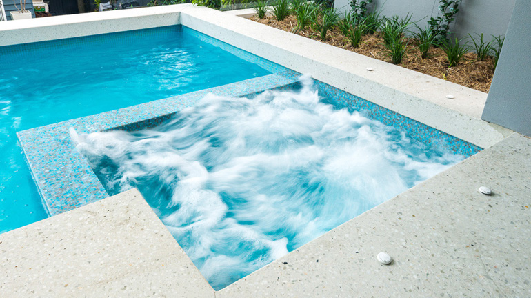 Geometric swimming pool with spa