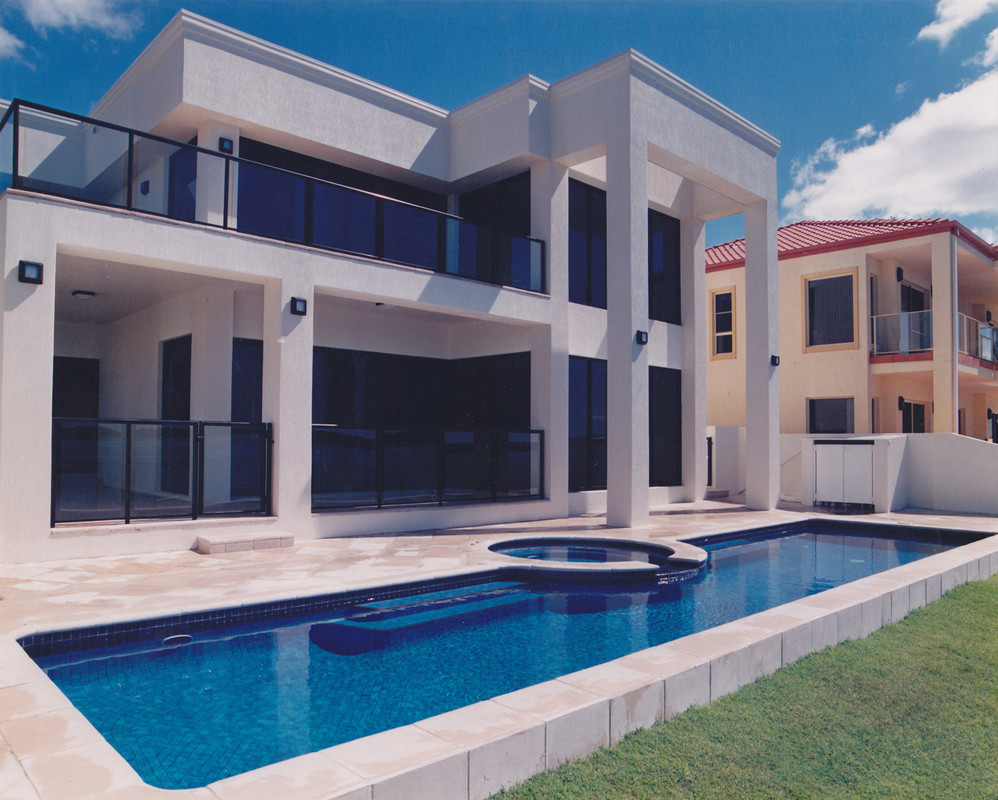Lap Pool next to a waterfront house